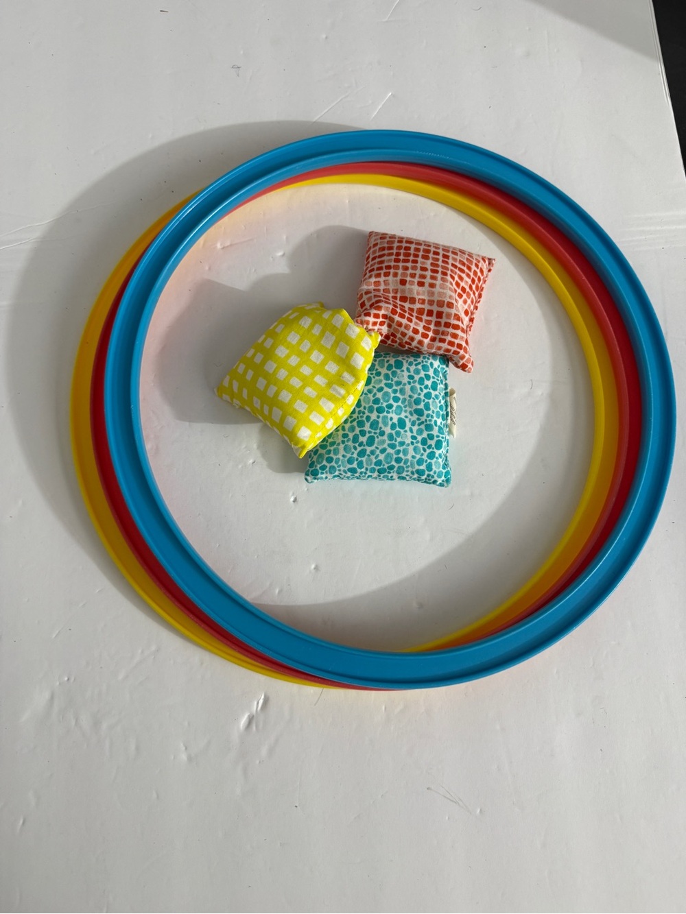 Lovevery hoops and beanbag toss game